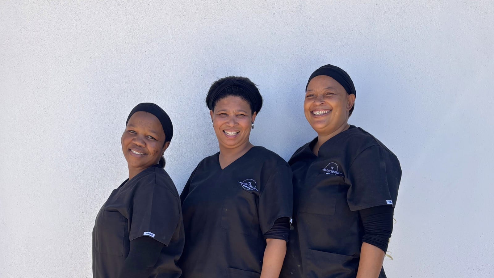 Spotless Cleaning Services cleaners posing as a group